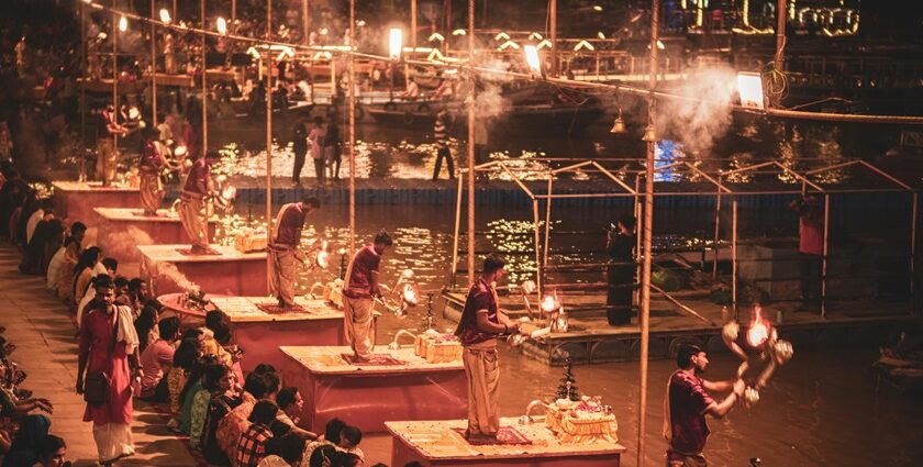 Ganga Aarti at Varanasi ghat during Dev Deepawali in Varanasi with glowing diyas and crowd.