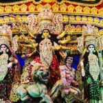 Inside view of a pandal displaying ornate idols of Goddess Durga during Durga Puja in Kolkata.