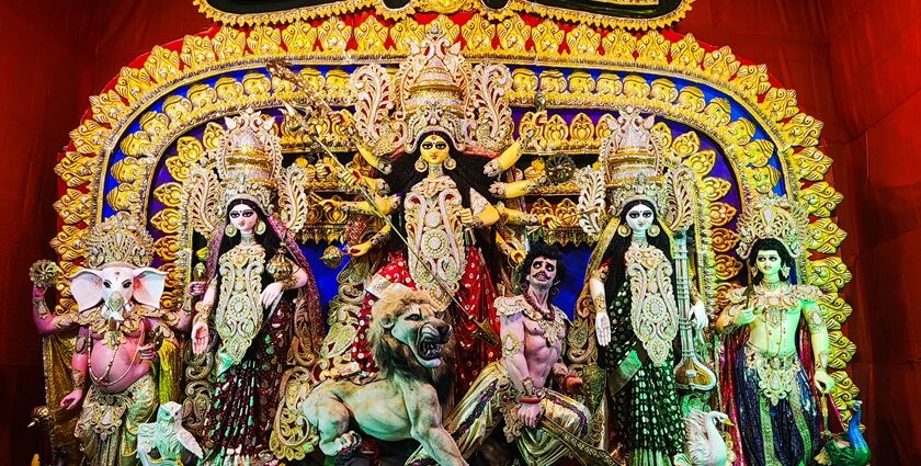 Inside view of a pandal displaying ornate idols of Goddess Durga during Durga Puja in Kolkata.
