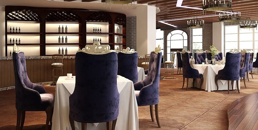 Interior of Barbeque Nation with white tablecloths and purple chairs, one of the family restaurants in Guwahati.