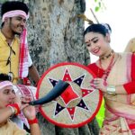 Artists with trumpet and dhols perform Bihu Dance at Rongali Bihu, festivals in North East India.