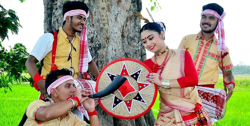 Artists with trumpet and dhols perform Bihu Dance at Rongali Bihu, festivals in North East India.