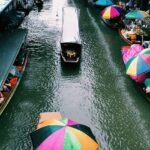 Boats and vendors at Amphawa, one of the top floating markets in Thailand.