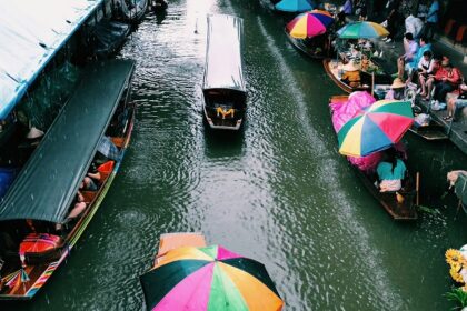 Boats and vendors at Amphawa, one of the top floating markets in Thailand.