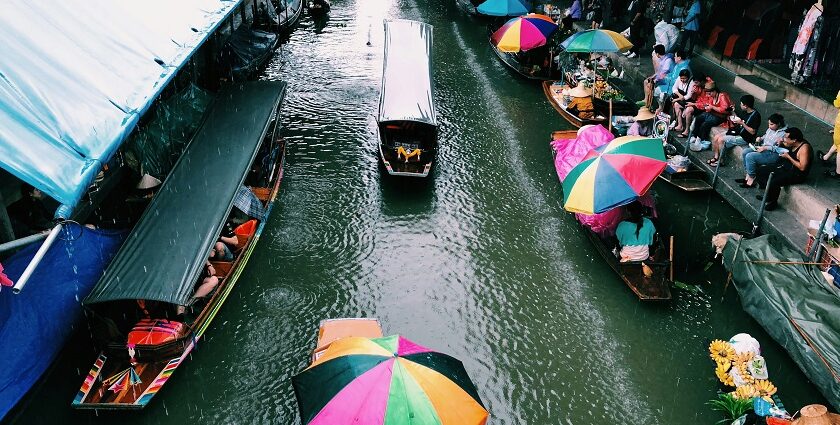 Boats and vendors at Amphawa, one of the top floating markets in Thailand.