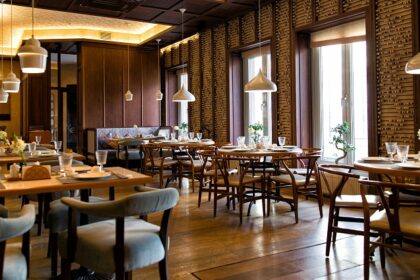 Modern restaurant with furniture, plants, and lights, one of the best Indian restaurants in Clarke Quay, Singapore.