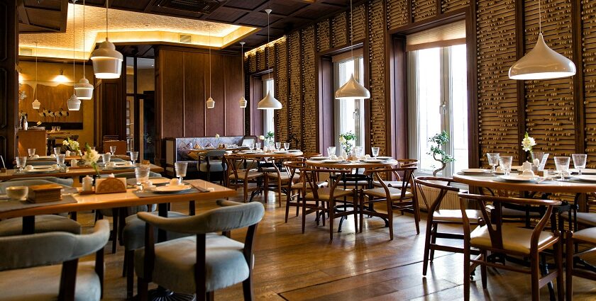 Modern restaurant with furniture, plants, and lights, one of the best Indian restaurants in Clarke Quay, Singapore.