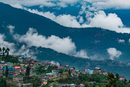 Aerial view of Darjeeling city near mountains, showcasing scenic landscapes and offbeat places in Darjeeling.