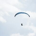 Paragliding in Karnataka, with a view of serene clouds from high above, captures peaceful skies.
