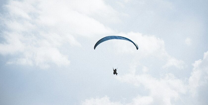 Paragliding in Karnataka, with a view of serene clouds from high above, captures peaceful skies.