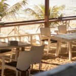 A simple beachside restaurant with red chairs on Shaheed Dweep, formerly Neil Island.