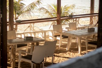 A simple beachside restaurant with red chairs on Shaheed Dweep, formerly Neil Island.