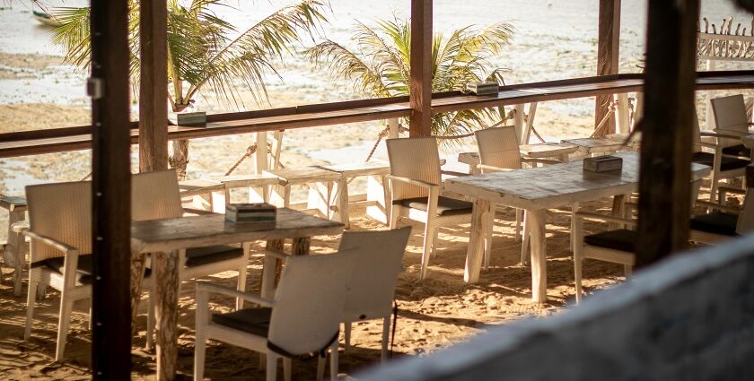A simple beachside restaurant with red chairs on Shaheed Dweep, formerly Neil Island.