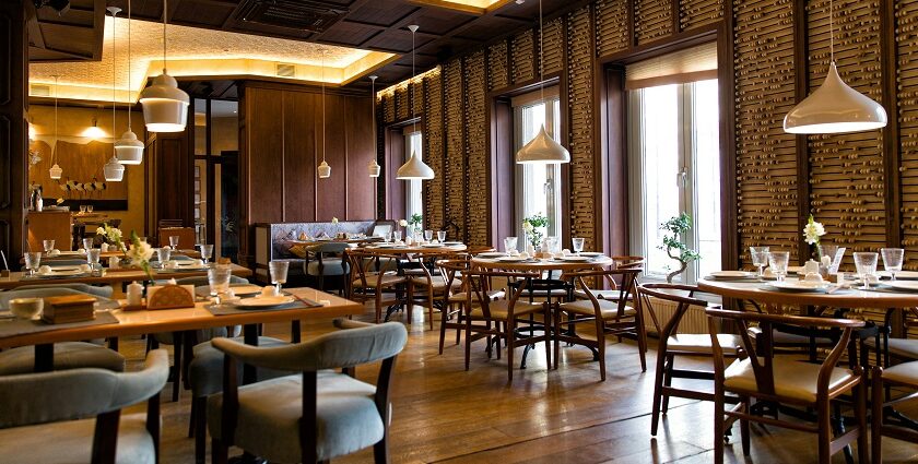 Interior of Taste Of Tibet with tables, chairs, and hanging lights, one of the top restaurants in Gangtok.