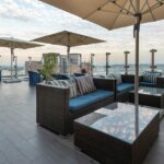 Daytime rooftop dining setup with city views at rooftop restaurants in Siliguri.