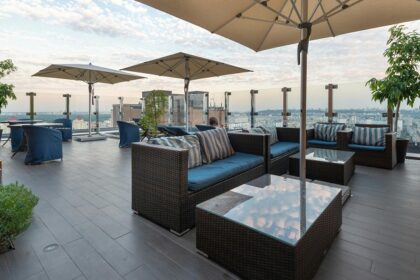 Daytime rooftop dining setup with city views at rooftop restaurants in Siliguri.