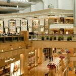 Interior view of Lulu Mall with shops and bright lighting, showcasing shopping in Kerala.
