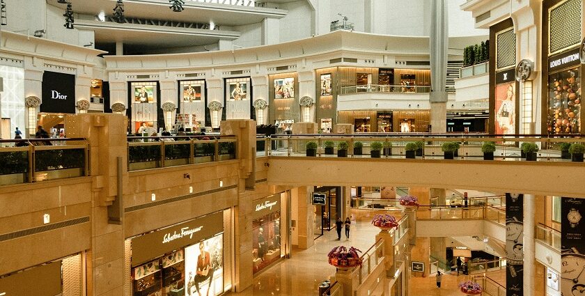 Interior view of Lulu Mall with shops and bright lighting, showcasing shopping in Kerala.