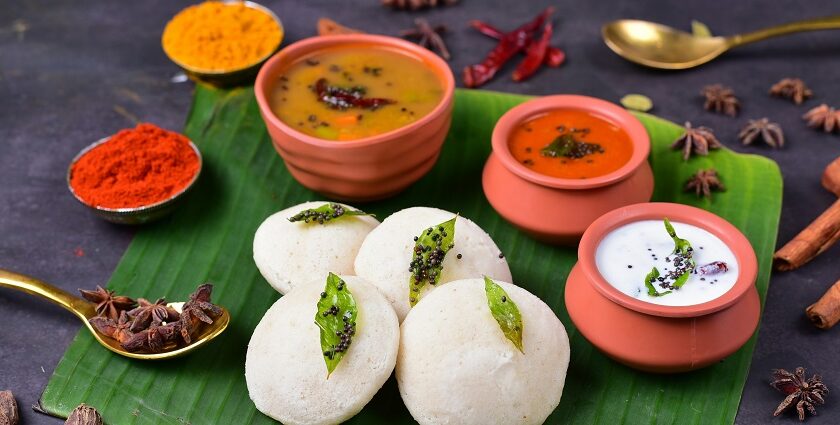 Idli and sambar with chutneys served on a banana leaf at South Indian restaurants in Kuala Lumpur.