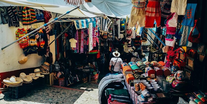 Assorted colourful clothes displayed at a bustling Jade market, one of the best street markets in Hong Kong.