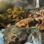 Wimberley Gunj Waterfall flows through a lush forest, one of the waterfalls in Andaman.