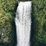Corbett Falls, surrounded by lush forest, is a serene spot among waterfalls in Uttarakhand.