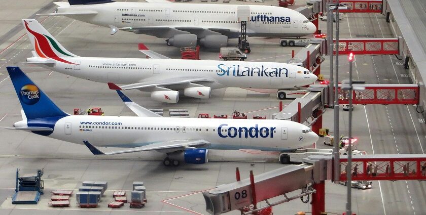 Airplanes on grey runway at one of the major airports in Kerala.