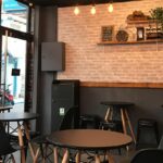 Elegant interior of Kameng Fusion with black chairs and lights, one of the best restaurants in Itangar.