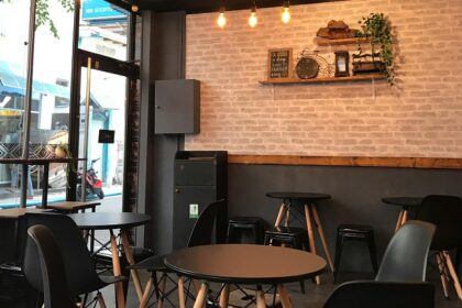 Elegant interior of Kameng Fusion with black chairs and lights, one of the best restaurants in Itangar.