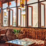 Cosy cafe Shillong interior with wooden lounge chair and table, one of the top restaurants in Shillong.