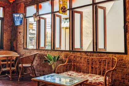 Cosy cafe Shillong interior with wooden lounge chair and table, one of the top restaurants in Shillong.