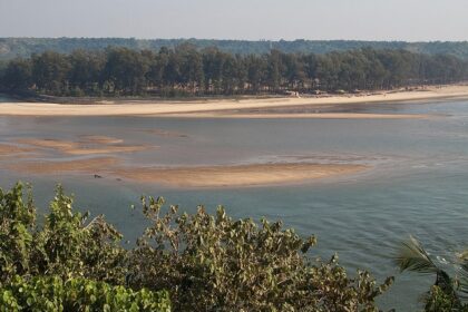 Scenic view of river meeting Querim Beach in Goa perfect for road trips from Goa.