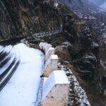 Scenic view of snow covering the hills showcasing the season of snowfall in Himachal Pradesh.