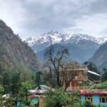 Snow-capped Shivalik mountains viewed from Kasol village, Himachal Pradesh, showing snowfall in Kasol.