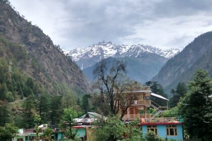 Snow-capped Shivalik mountains viewed from Kasol village, Himachal Pradesh, showing snowfall in Kasol.