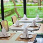 Elegant interior of JB’s Restaurant with stylish table setting, one of the finest veg restaurants in Guwahati.