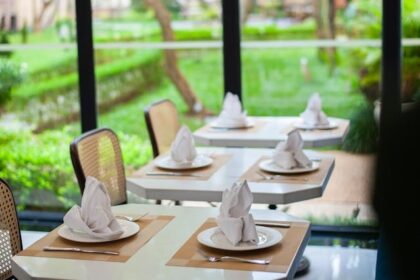 Elegant interior of JB’s Restaurant with stylish table setting, one of the finest veg restaurants in Guwahati.
